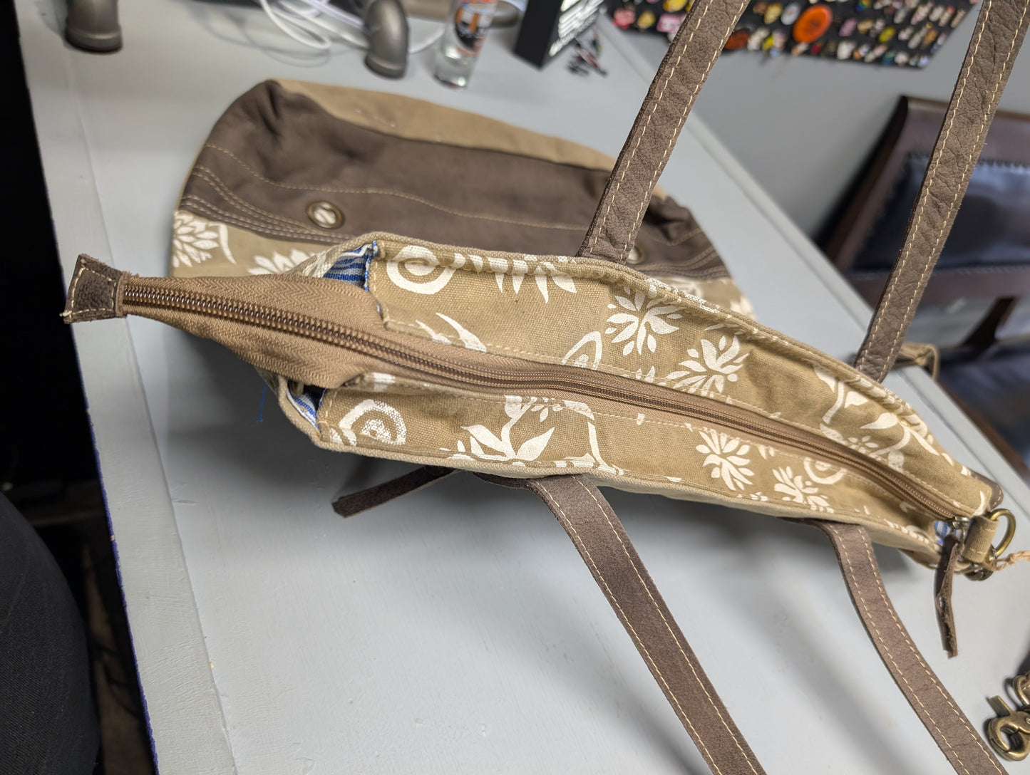 Tan canvas with floral pattern purse