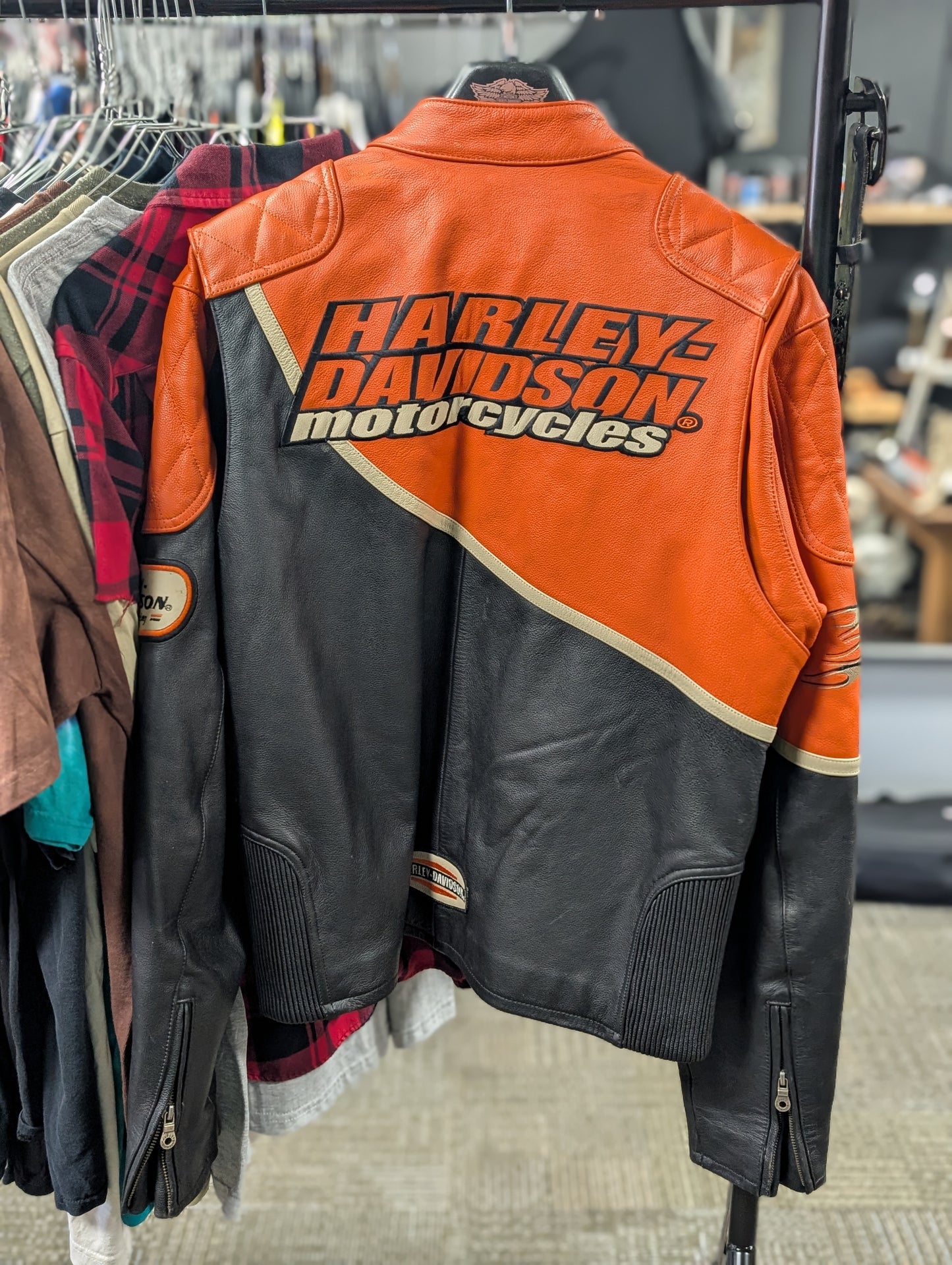 Orange and black HD Harley-Davidson motorcycles men's size large leather jacket for riding motorcycles