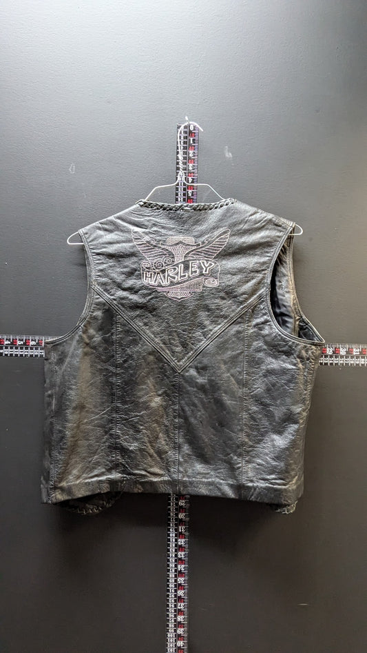 Gray sleeveless jacket with branding on a gray background