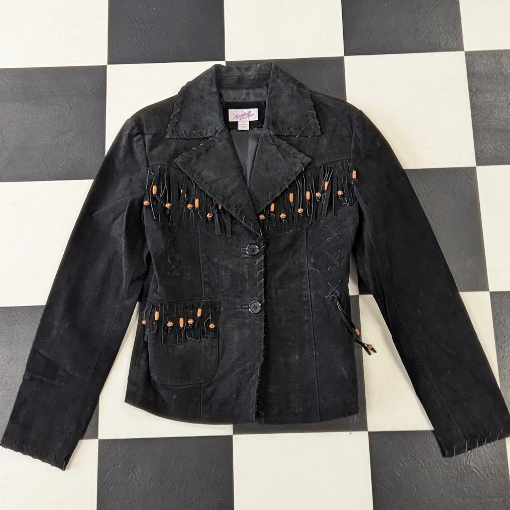 Leather suede jacket with orange buttons and decorative elements on a checkered background