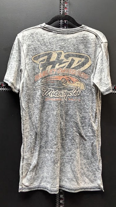 A vintage acid-wash gray t-shirt hanging on a black hanger against a dark gray wall, featuring a distressed graphic on the front with the words 'Faded Motorcycle' in orange and cream.