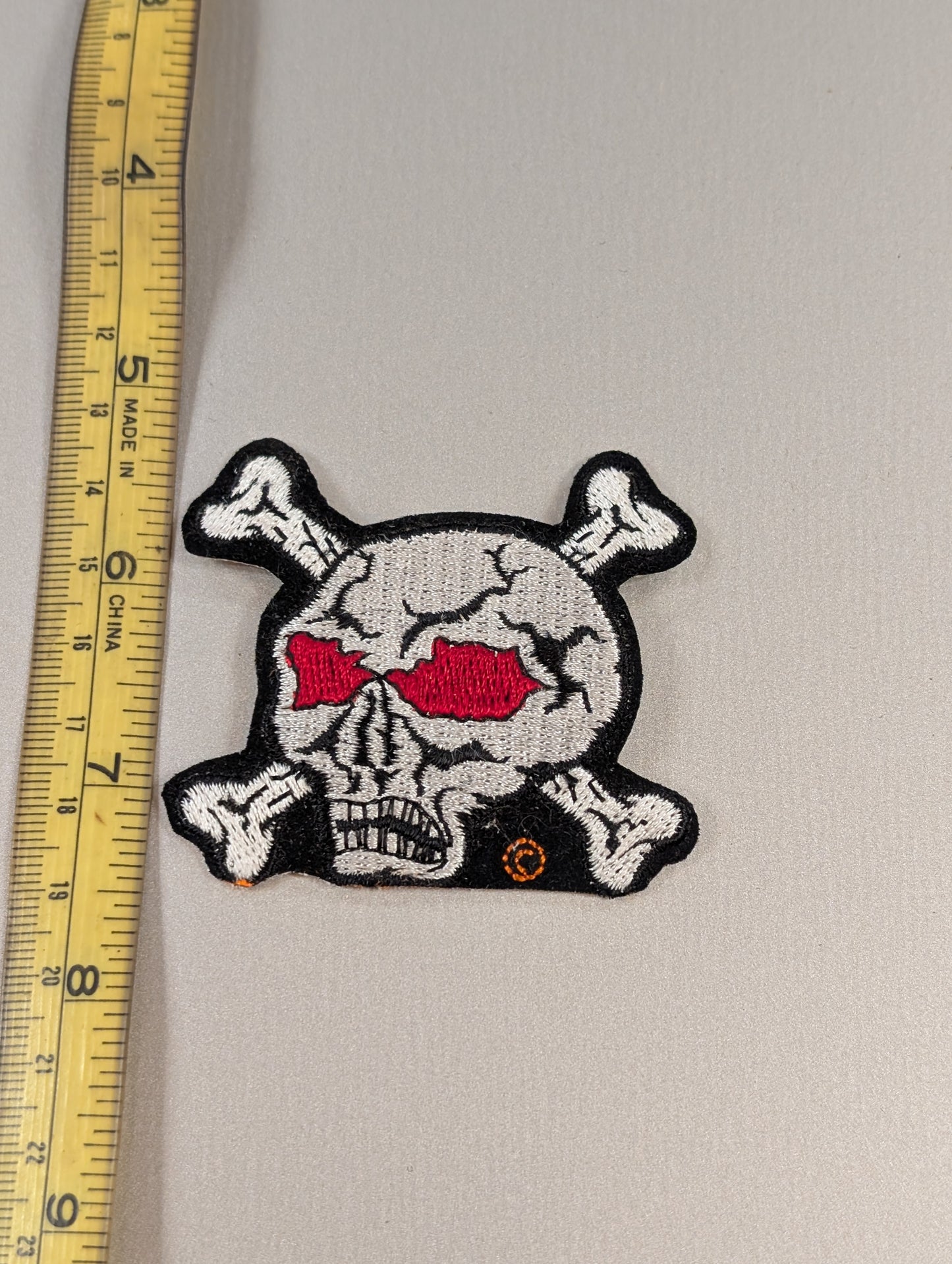 Embroidered Skull & Crossbones Patch – Red Eye Detail