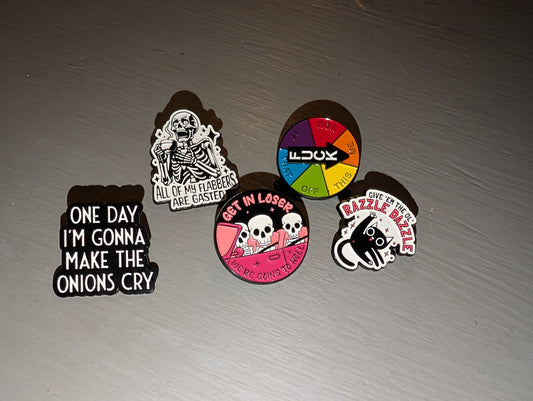 F+ck spinning pin, “one day I’m gonna make the onions cry” pin, “get in loser we’re going to hell”, and prochoice pin?