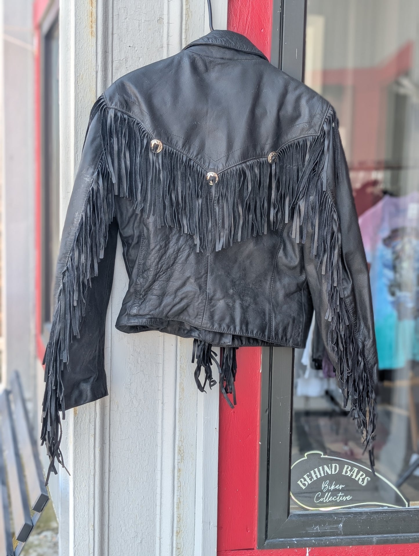 Black leather coat with fringes